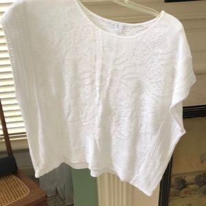 Deep armhole, sleeveless sweater.